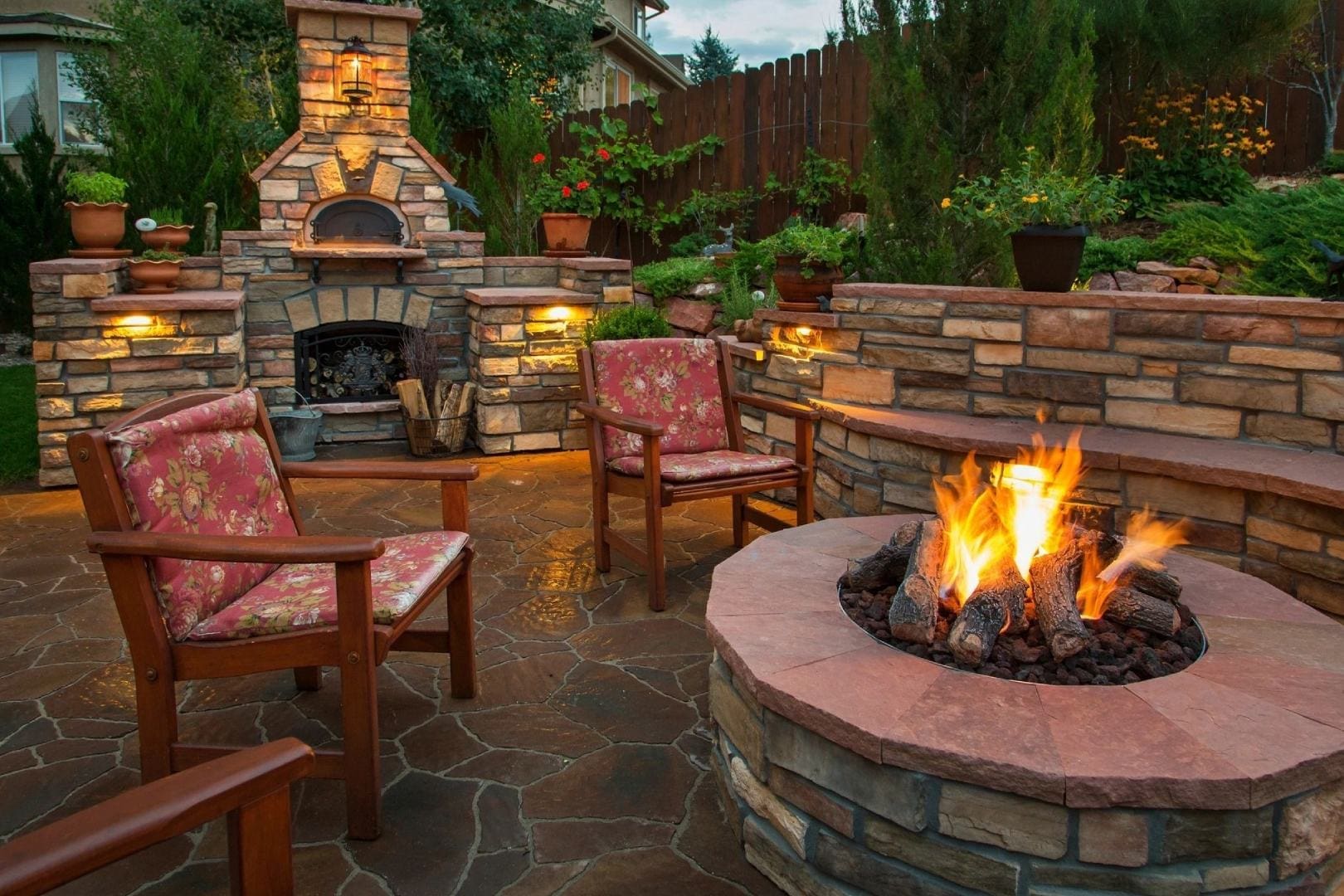 A fire pit with chairs around it