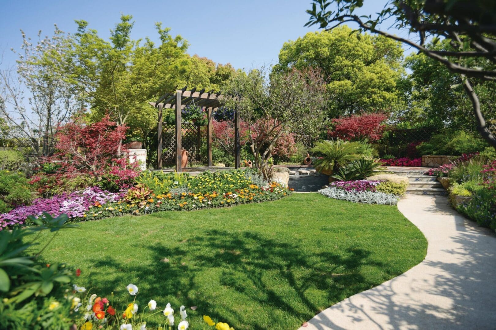 A garden with many flowers and trees